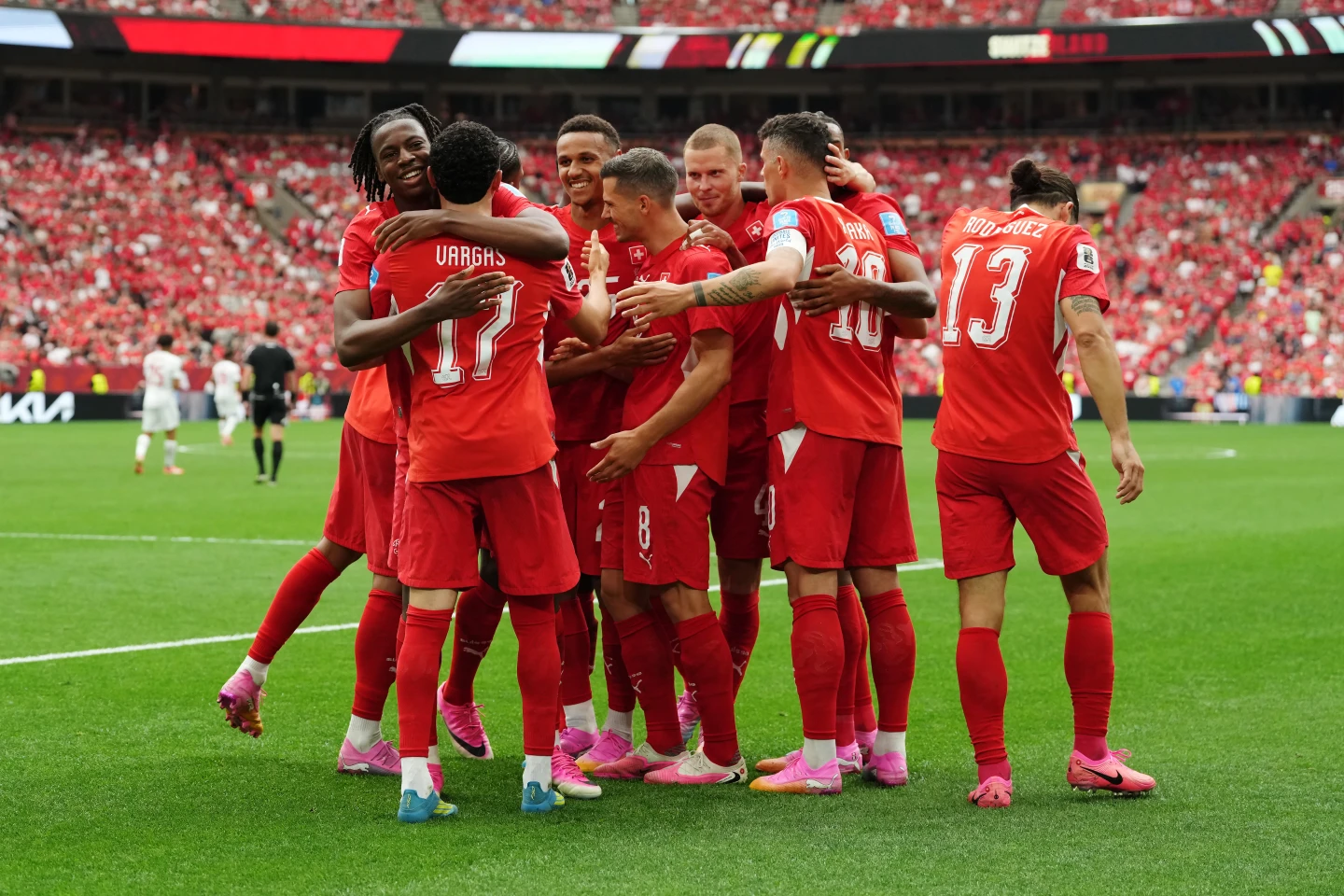 (Switzerland’s Ruben Vargas (17) is mobbed by teammates after scoring their first goal during the World Cup Group B soccer match between Switzerland and Canada in Vancouver, British Columbia, Wednesday, June 24, 2026.  Photo: Ethan Cairns-The Canadian Press)