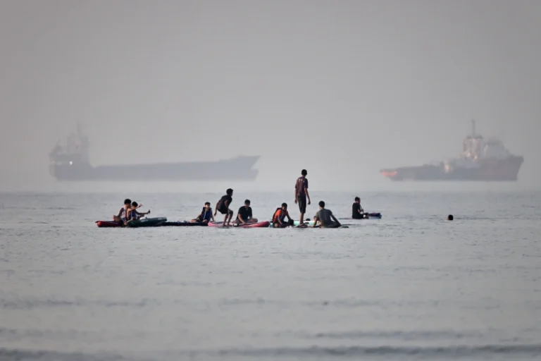 (People gather on paddleboards in shallow water as cargo and service vessels are anchored in the Strait of Hormuz off Bandar Abbas, Iran, Monday, June 1, 2026. Photo: Amirhosein Khorgooi-ISNA via AP)