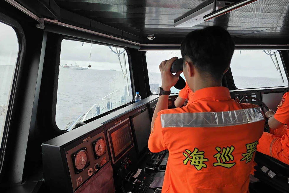 (In this photo released by the Taiwan Coast Guard, a Taiwan Coast Guard member monitor Chinese navy vessel operating near the Pengjia Islet north of Taiwan on Thursday, May 23, 2024. (Taiwan Coast Guard via AP, file)