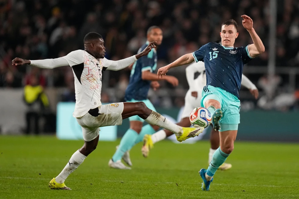 (Thomas Partey of Ghana and Nico Schlotterbeck of Germany challenge for the ball during an international friendly soccer match between Germany and Ghana in Stuttgart, Germany, March 30, 2026.  AP File Photo: Matthias Schrader)
