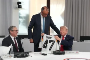  
 (German Chancellor Friedrich Merz on Tuesday gave U.S. President Donald Trump a soccer jersey with his name and the number 47 on the back. Photo: AP)