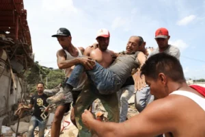 (Back-to-back powerful earthquakes slammed Venezuela on Wednesday evening, collapsing buildings in the capital of Caracas and leaving residents shaken. (AP Photo: Juan Arraez & Andry Rincon)