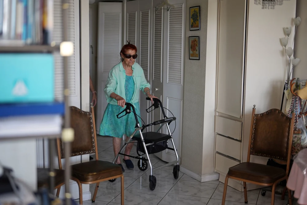 (Anna Fischbein at her apartment in Sunny Isles Beach, Fla. on Thursday. Photo AP: Rebecca Blackwell)