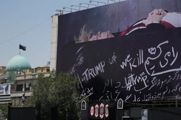 (A billboard depicting U.S. President Donald Trump lying on what appears to be a coffin and bearing anti-Trump messages, including the phrase “We Kill Trump,” is seen at Islamic Revolution Square in downtown Tehran, Iran, Wednesday, July 15, 2026.  AP Photo: Vahid Salemi)