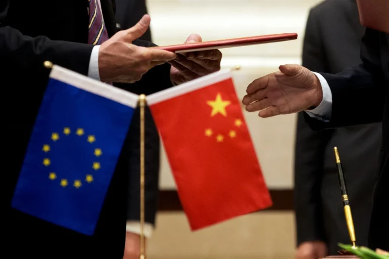 (A member of European Commission, left, prepares to exchange documents with Chinese delegation at a signing ceremony after the 5th China-EU High Level Economic and Trade dialogue at Diaoyutai State Guest House in Beijing, on Sept. 28, 2015.  AP File Photo: Andy Wong.)