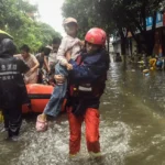 (In this photo released by Xinhua News Agency, rescuers evacuate stranded residents in the aftermath of tropical storm Maysak in Qinzhou City, south China’s Guangxi Zhuang Autonomous Region Tuesday, July 7, 2026.  Photo: Zhang Ailin: Xinhua via AP)