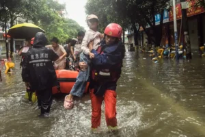 (In this photo released by Xinhua News Agency, rescuers evacuate stranded residents in the aftermath of tropical storm Maysak in Qinzhou City, south China’s Guangxi Zhuang Autonomous Region Tuesday, July 7, 2026.  Photo: Zhang Ailin: Xinhua via AP)