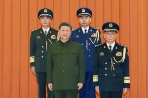 (In this photo released by Xinhua News Agency, Chinese President Xi Jinping, bottom left, who is also Chairman of the Central Military Commission (CMC) poses for photos with newly promoted generals Wang Shuguang, top left and Wang Gang, top right while Zhang Shengmin, Vice Chairman of the CMC stands at the right in Beijing, on Friday, July 3, 2026. Photo: Li Gang-Xinhua via AP)