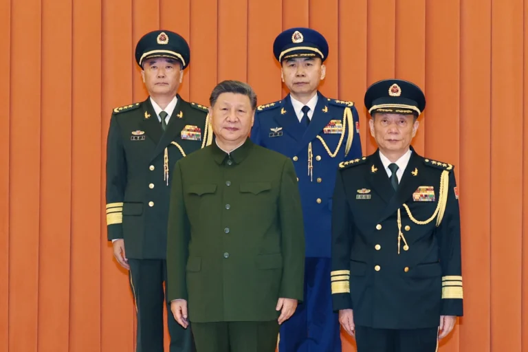 (In this photo released by Xinhua News Agency, Chinese President Xi Jinping, bottom left, who is also Chairman of the Central Military Commission (CMC) poses for photos with newly promoted generals Wang Shuguang, top left and Wang Gang, top right while Zhang Shengmin, Vice Chairman of the CMC stands at the right in Beijing, on Friday, July 3, 2026. Photo: Li Gang-Xinhua via AP)