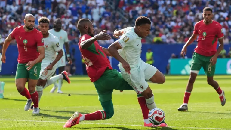 (France's Kylian Mbappe (10) is tripped by Morocco's Issa Diop (14) during the World Cup quarterfinal soccer match between France and Morocco in Foxborough, Mass., near Boston, Thursday, July 9, 2026. AP Photo: Stephanie Scarbrough)