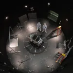 (This photo provided by NASA shows Kieran Wilson, LINK’s principal investigator, and Hunter Robertson, a space systems engineer, both at Katalyst Space, standing next to their spacecraft inside the SES (Space Environment Simulator) at NASA’s Goddard Space Flight Center in Greenbelt, Md., April 17, 2026, ahead of thermal vacuum testing. AP File Photo: Sophia Roberts-NASA)