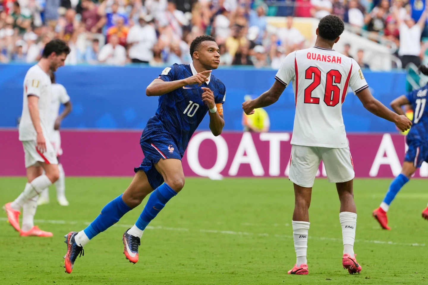 (France's Kylian Mbappe (10) celebrates scoring his side's third goal as England's Jarell Quansah (26) reacts to the score during the World Cup third-place playoff soccer match between France and England in Miami Gardens, Fla., Saturday, July 18, 2026.  AP Photo: Rebecca Blackwell)