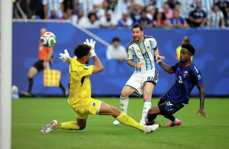 (Argentina's Lionel Messi (10) scores their first goal against Cape Verde goalkeeper Vozinha (1) during the World Cup round of 32 soccer match between Argentina and Cape Verde in Miami Gardens, Fla., Friday, July 3, 2026. AP Photo: George Walker IV)