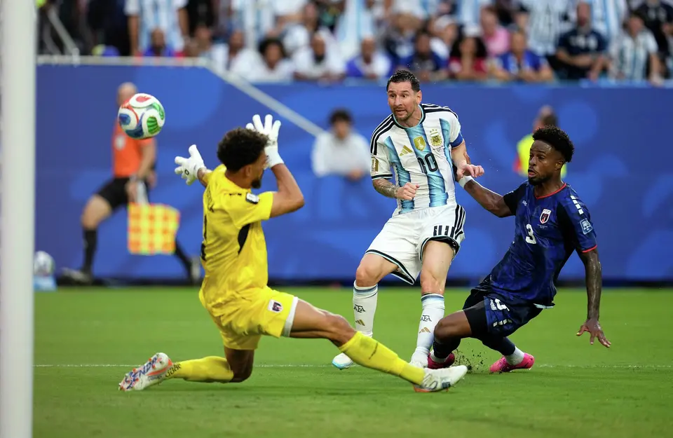 (Argentina's Lionel Messi (10) scores their first goal against Cape Verde goalkeeper Vozinha (1) during the World Cup round of 32 soccer match between Argentina and Cape Verde in Miami Gardens, Fla., Friday, July 3, 2026. AP Photo: George Walker IV)