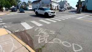 (The Immigration and Customs Enforcement officer who shot a Colombian man in Maine this week is an Army veteran who has struggled with serious mental health issues since early childhood, his ex-wife tells AP.  AP Photo:  Rodrique Ngowi)