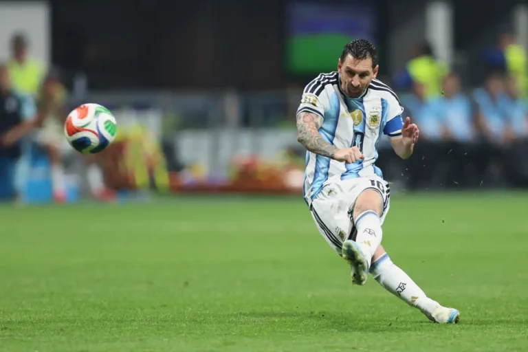 (Argentina's Lionel Messi takes a free kick during the World Cup round of 16 soccer match between Argentina and Egypt in Atlanta, AP Photo: .Colin Hubbard)