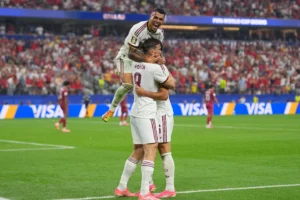 (Spain's Pedro Porro, top, congrats Spain's Mikel Merino, right, after scored during the World Cup round of 16 soccer match between Portugal and Spain in Arlington, Texas, near Dallas, Monday, July 6, 2026. AP Photo: Julio Cortez)