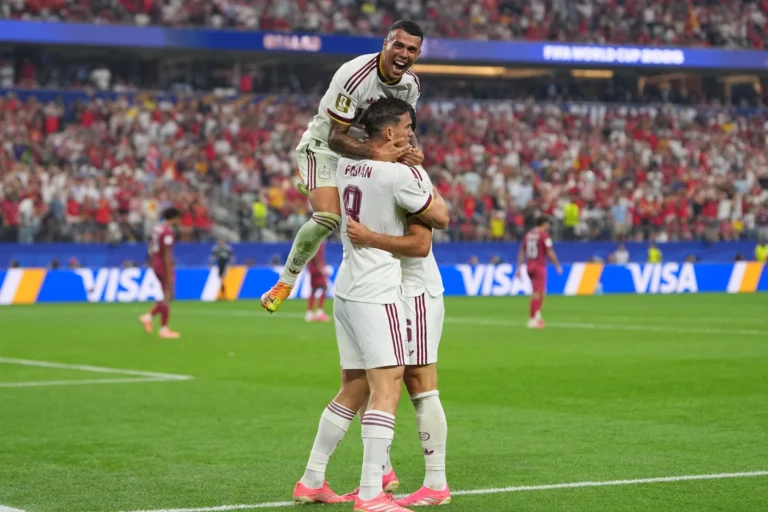 (Spain's Pedro Porro, top, congrats Spain's Mikel Merino, right, after scored during the World Cup round of 16 soccer match between Portugal and Spain in Arlington, Texas, near Dallas, Monday, July 6, 2026. AP Photo: Julio Cortez)