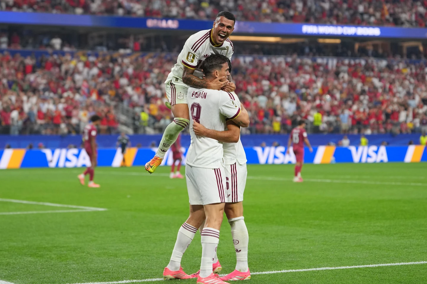 (Spain's Pedro Porro, top, congrats Spain's Mikel Merino, right, after scored during the World Cup round of 16 soccer match between Portugal and Spain in Arlington, Texas, near Dallas, Monday, July 6, 2026. AP Photo: Julio Cortez)
