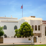 Inscription in Arabic reads: Embassy of the Republic of Nepal. Building of Embassy of Republic of Somalia in the city of Muscat. Sultanate of Oman