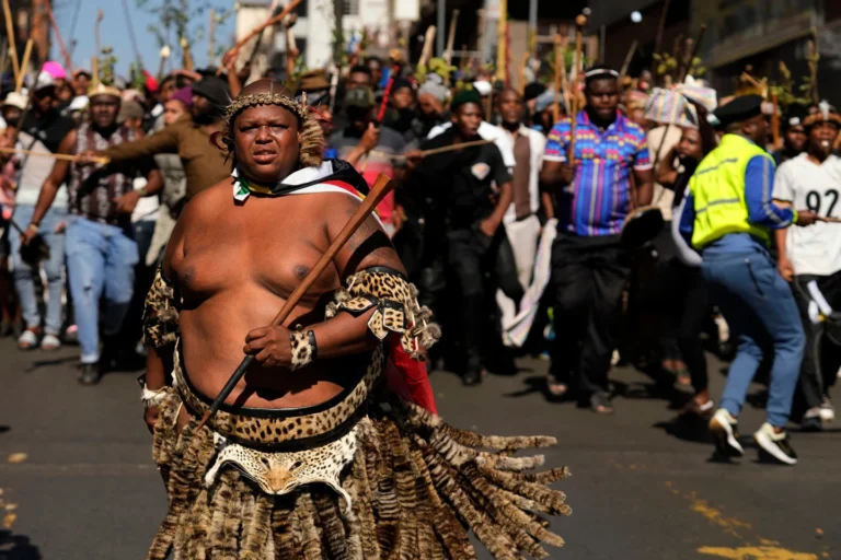 (A protester dressed traditional attire march against illegal immigration, in Johannesburg, South Africa, Tuesday, June 30, 2026. AP Photo: Themba Hadebe)