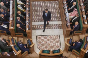 (Syrian President Ahmad al-Sharaa walks through the chamber after addressing the inaugural session of Syria's newly formed People's Assembly, the first since the fall of President Bashar Assad's government, in Damascus, Syria, Sunday, July 12, 2026. AP Photo: Ghaith Alsayed)