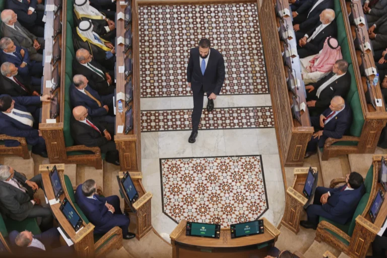 (Syrian President Ahmad al-Sharaa walks through the chamber after addressing the inaugural session of Syria's newly formed People's Assembly, the first since the fall of President Bashar Assad's government, in Damascus, Syria, Sunday, July 12, 2026. AP Photo: Ghaith Alsayed)