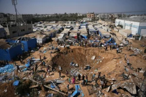 (Palestinians inspect the scene of an Israeli airstrike near al-Aqsa Hospital in Deir al-Balah in the central Gaza Strip, Saturday, Aug. 1, 2026. AP Photo: Abdel Kareem Hana)