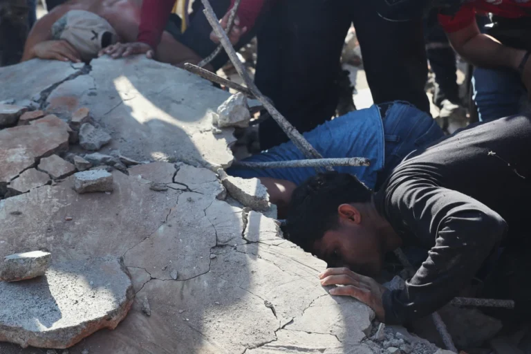 (Residents and rescue workers search through the rubble of a collapsed building after an earthquake struck Cali, Colombia, Monday, Aug. 10, 2026.  AP Photo: Santiago Saldarriaga)