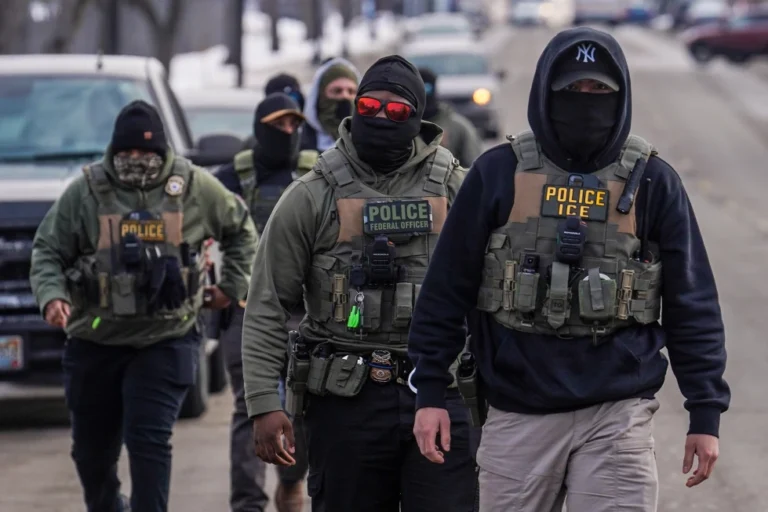 (Federal agents walk down a street while conducting immigration enforcement operations in Minneapolis, Feb. 5, 2026.  AP File Photo: Ryan Murphy)