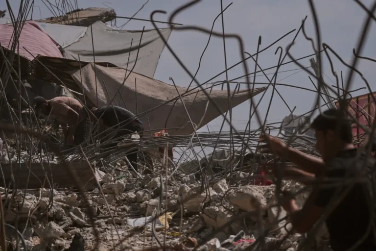 (Palestinians remove iron from the rubble of buildings destroyed by Israeli airstrikes during the war with Hamas, repair and recycle it for construction, building tents or selling it, in Gaza City, Sunday, Aug. 16, 2026. AP Photo: Jehad Alshrafi)