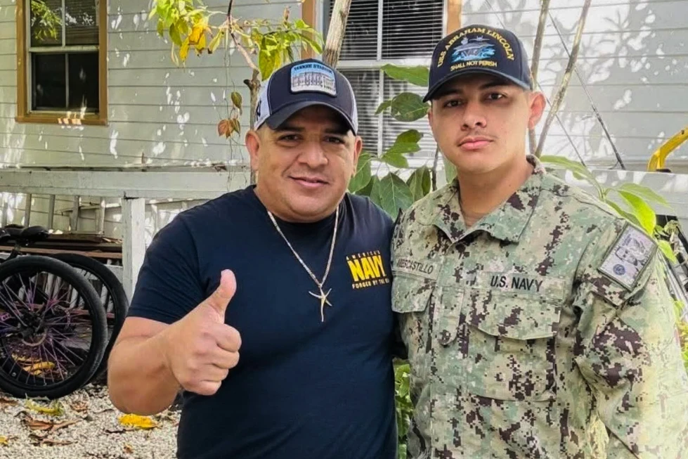 (In this photo courtesy of Katherine Delgado shows her step-father Luis Manuel Aviles, left, and her brother Joshua Aviles stand outside their home in Oct. 2025, shortly before Joshua deployed on the USS Lincoln the following month in Key West, Fla.  Photo: Katherine Delgado via the AP)