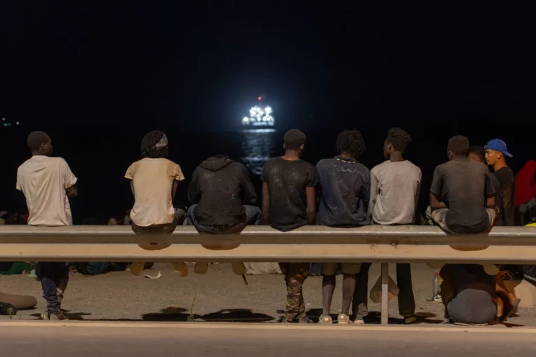 (Migrants who crossed into Spain from Morocco gather on a beach in the Spanish enclave of Ceuta, Sunday, Aug. 2, 2026. AP Photo: Antonio Sempere)