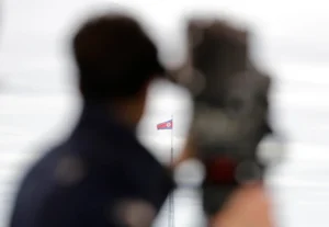 (A North Korean flag flutters in the wind atop a 160-meter tower in North Korea’s village Gijungdong as seen from the Taesungdong freedom village inside the demilitarized zone in Paju, South Korea on April 24, 2018.  AP Photo: Lee Jin-man, File)