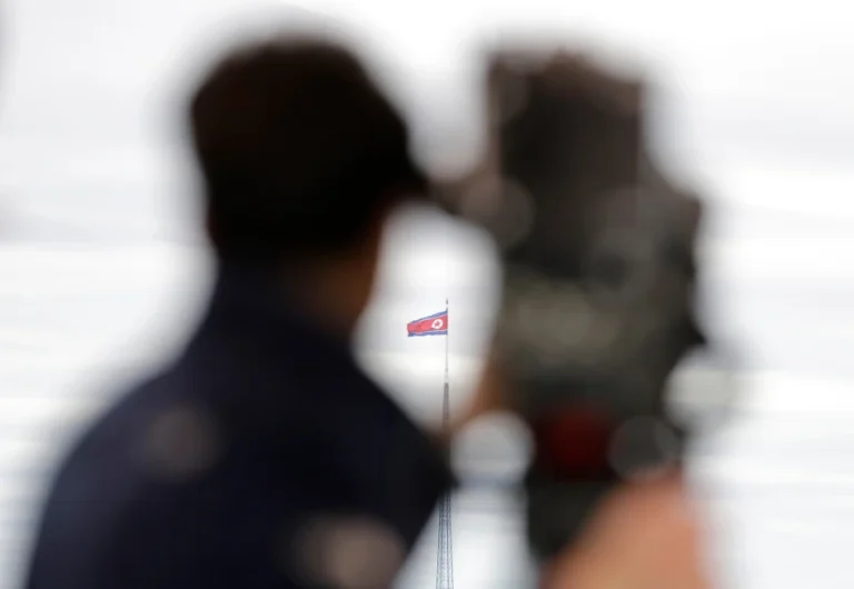 (A North Korean flag flutters in the wind atop a 160-meter tower in North Korea’s village Gijungdong as seen from the Taesungdong freedom village inside the demilitarized zone in Paju, South Korea on April 24, 2018.  AP Photo: Lee Jin-man, File)