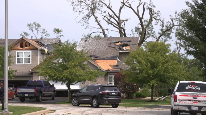(In this image made from video, a roof is damaged after a strong storm in Tinley Park, Ill., Tuesday, Aug. 11, 2026. AP Photo: Laura Bargfeld)
