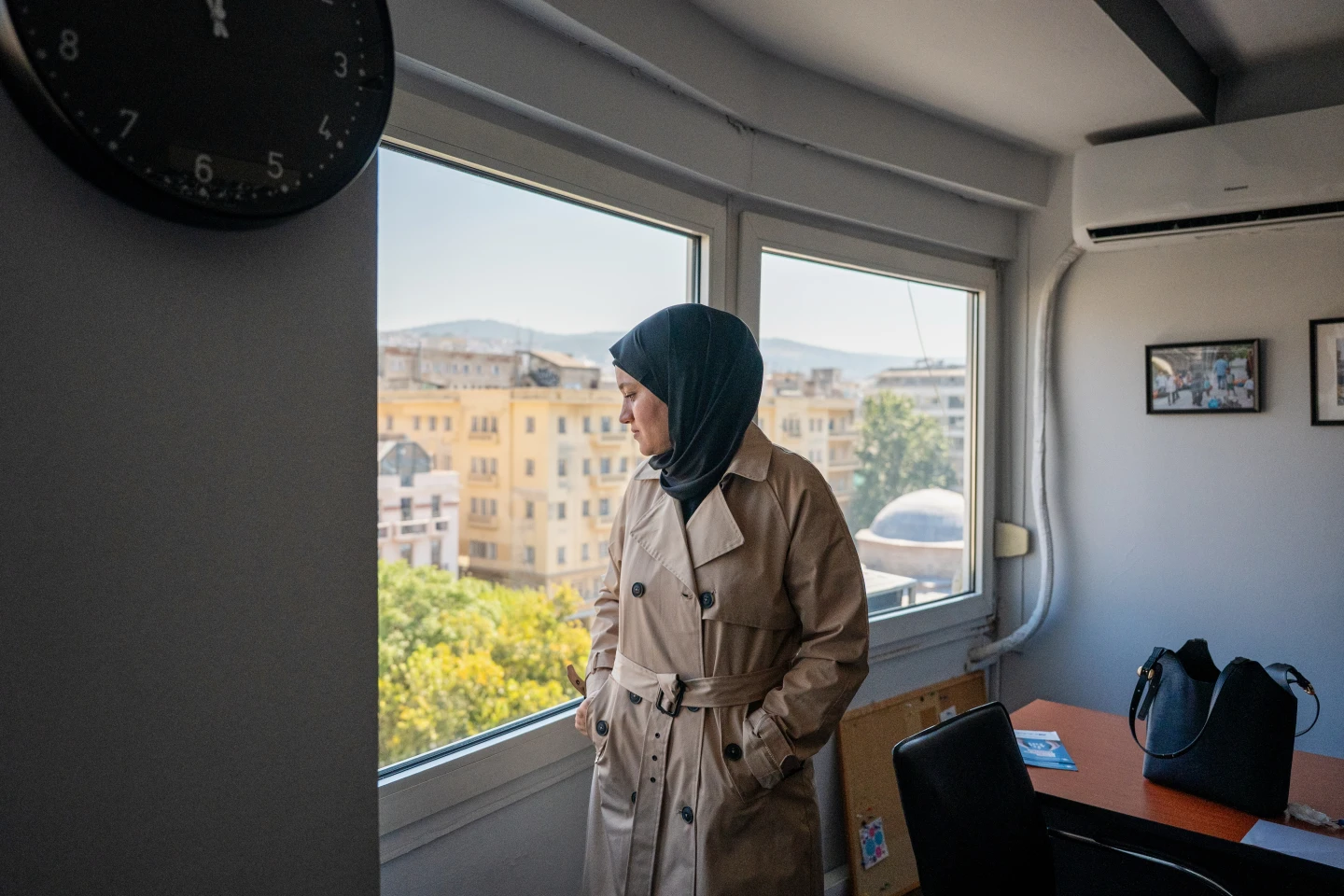 (Wesam Hamada, the mother of Hind Rajab, a Palestinian girl who was killed in Gaza City in January 2024 after the car she was in with relatives came under Israeli fire, looks out a window at an office building at an undisclosed location, Friday, Aug. 21, 2026.  AP Photo: Giannis Papanikos)