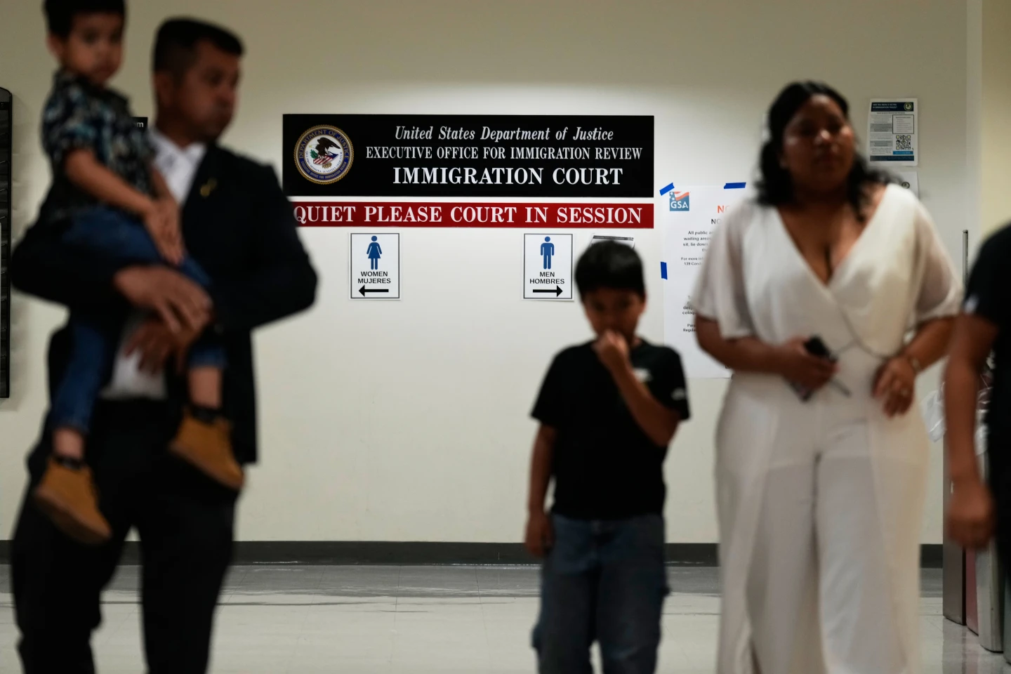 (People arrive for immigration court hearings in New York in July. AP Photo: Seth Wenig)