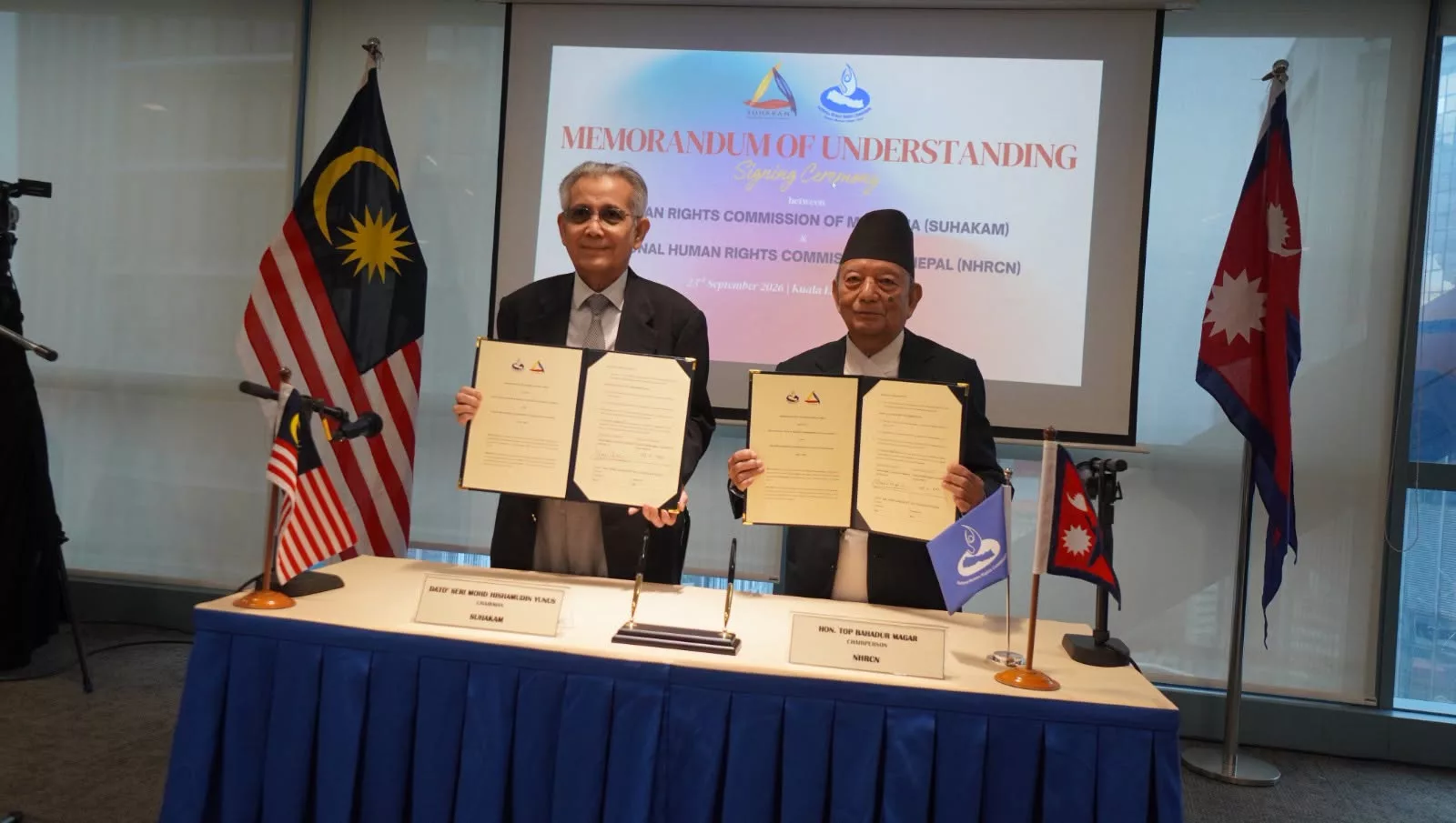 KUALA LAMPUR:- The National Human Rights Commissions of Malaysia and Nepal have renewed a Memorandum of Understanding (MoU) aimed at protecting the rights of migrant workers and the general public residing in both countries.
The agreement between the Human Rights Commission of Malaysia (SUHAKAM) and the National Human Rights Commission of Nepal (NHRC-Nepal) has been renewed for a three-year period, spanning from 2026 to 2028.
Dato’ Seri Mohamed Hishamudin Yunus, Chairperson of SUHAKAM, and Top Bahadur Magar, Chairperson of the National Human Rights Commission of Nepal, signed the agreement at a ceremony held at the SUHAKAM headquarters in Kuala Lumpur, Malaysia.
First signed in 2019, this Memorandum of Understanding—which covers the protection of workers' rights, bilateral communication regarding complaints, joint monitoring, investigations, and information exchange—had been renewed twice and remained in effect until March 28, 2024. Throughout this period, Suhakam has continuously collaborated with various non-governmental organizations, civil society, and the Nepali Embassy in Kuala Lumpur to assess the situation of the approximately 400,000 Nepali workers in Malaysia.
Between 2021 and August 2026, 46 complaints regarding human rights violations against Nepali workers were filed in Suhakom. The complaints cite serious issues such as employers confiscating passports, requiring work for 12 hours a day for 30 consecutive days without breaks, withholding or delaying wages, demanding unpaid overtime, and maintaining unsafe working environments.
Under the renewed agreement, both commissions will investigate incidents of human rights violations against workers, monitor conditions in detention centers, study the causes of high mortality rates, and conduct policy advocacy regarding recruitment fees and the risk of forced labor.
Furthermore, both commissions have agreed to facilitate increased access for Nepali workers to Malaysia's social security scheme (SOCSO), collaborate on protecting the rights of female workers and promoting gender equality, review laws and policies to provide recommendations to the government, and assist in enhancing the capacity of workers in the security sector.
During the agreement signing process, the Nepali delegation held bilateral discussions with the Embassy of Nepal in Malaysia, the Non-Resident Nepali Association (NRNA) Malaysia, the Malaysian Prison Department, and the Social Security Organization (SOCSO). Meanwhile, both commissions have urged Nepali workers who have experienced or witnessed human rights violations in Malaysia to register complaints with SUHAKAM by scanning a QR code. It has been stated that the complaints received will be addressed in accordance with SUHAKAM's confidentiality protocols and complaint resolution procedures.