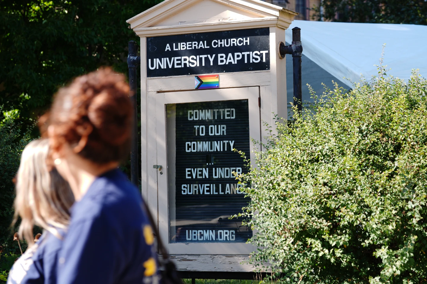 (People walk by a sign outside University Baptist Church, Friday, Sept. 4, 2026, in Minneapolis.  AP Photo: Ellen Schmidt)