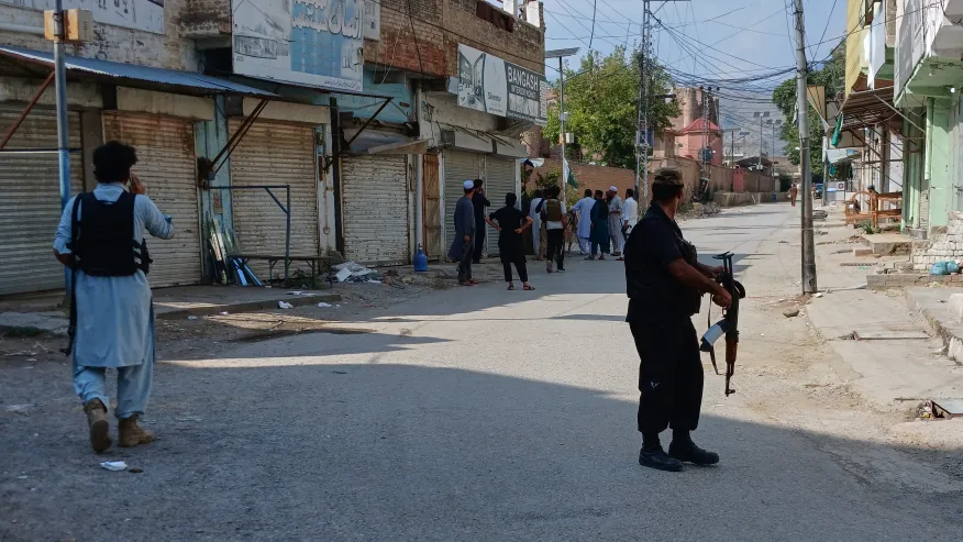 (In this photo taken with a smartphone, police officers secure a road leading to the site of a powerful bomb at a mosque in Kohat, Pakistan, Friday, Sept. 18, 2026. AP Photo: B.S. Gillani)