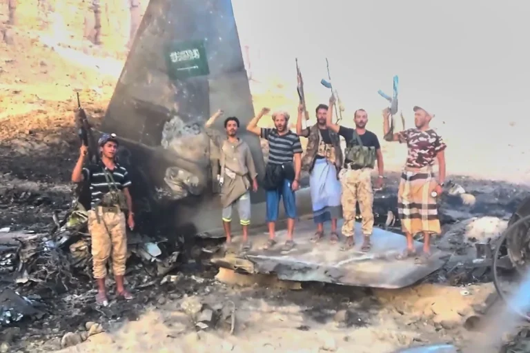 (Houthi fighters pose atop what the group described as the wreckage of a downed Saudi F-15 fighter jet in Marib province, Yemen, in an image released on Wednesday. Photo: Ansar Allah Media Office via AP)
