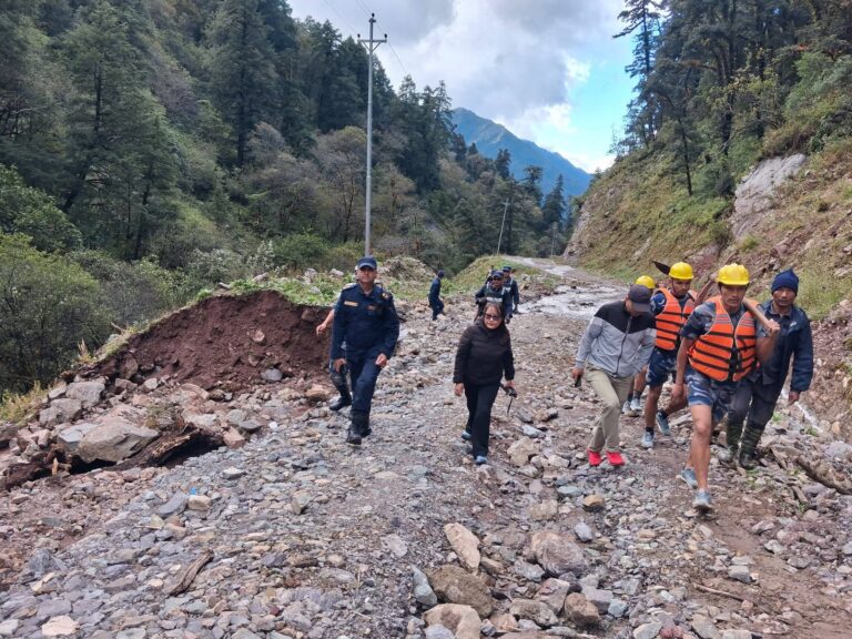 (Chief District Officer Kopila Rai and others inspecting the damaged road. Photo: District Administration Office, Rukum East)