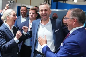 (Ulrich Siegmund, center, lead candidate and co-chair of the AfD state parliamentary group in Saxony-Anhalt, celebrates with Alice Weidel, federal chairwoman and co-chair of the AfD parliamentary group in the Bundestag, and Tino Chrupalla, federal chairman and co-chair of the AfD parliamentary group in the Bundestag, after the first results at an election party of the “Alternative for Germany” (AfD) after the Saxony-Anhalt state elections in Magdeburg, eastern Germany, Sunday, Sept. 6, 2026.  Michael Kappeler-dpa via AP)