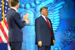 (Vice President JD Vance applauds as President Donald Trump arrives on the stage at the Republican convention Thursday, Sept. 10, 2026, in Dallas.  AP Photo: Julio Cortez)
