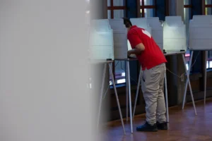 (A voter fills out their ballot for the primary election at Sacramento City College on June 2, 2026. Photo Curtsy: Miguel Gutierrez Jr., CalMatters)