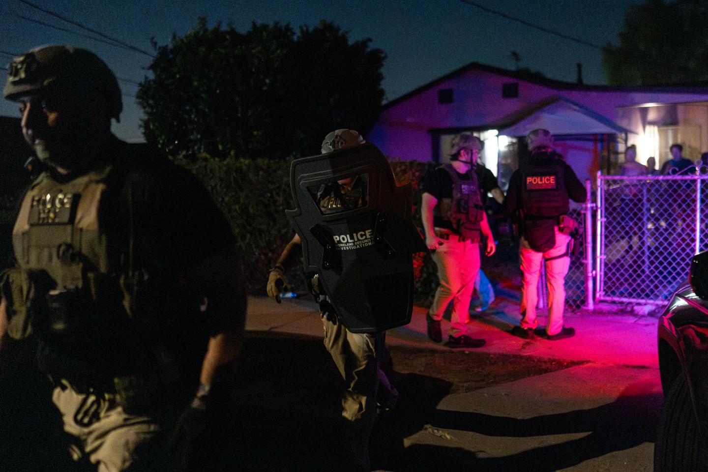 (Homeland Security Investigations officers leave a home after arresting a suspect accused of illegally registering to vote during a federal operation in Commerce, Calif., Monday, Oct. 19, 2026.  AP Photo: Jae C. Hong)