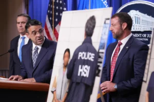 (Daniel Rosen, U.S. Attorney for the District of Minnesota, speaks during a news conference at the Department of Justice, Wednesday Sept. 30, 2026, in Washington, as Attorney General Todd Blanche, left, and Secretary of Homeland Security Markwayne Mullin, look on. (AP Photo: Jacquelyn Martin)