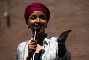 MINNEAPOLIS, MINNESOTA - AUGUST 8: U.S. Rep. Ilhan Omar (D-MN) speaks during a get out the vote event with Democratic Senate candidate, Minnesota Lt. Gov. Peggy Flanagan, at Cedar Field Park on August 8, 2026 in Minneapolis, Minnesota. Flanagan and Rep. Angie Craig (D-MN) will be vying for the Democratic nomination in the state's August 11 primary election. (Photo by Stephen Maturen/Getty Images)