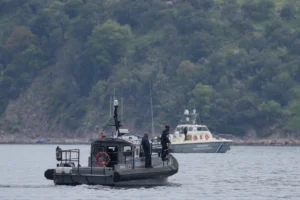 (Frontex, foreground, and Greek coast guard vessels take part in a search and rescue operation, after the capsizing of a boat carrying migrants, off the coast on the northeastern Aegean Sea island of Lesbos, Greece, on April 3, 2025. (AP Photo: Panagiotis Balaskas, File)